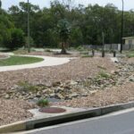 Garden at roundabout that have died from neglect poor plant selection