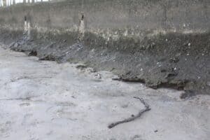 Canal wall showing undermining which is causing it to fall